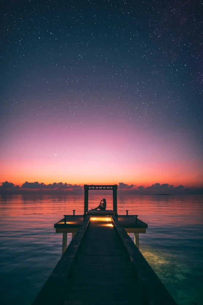 people on dock during golden hour
